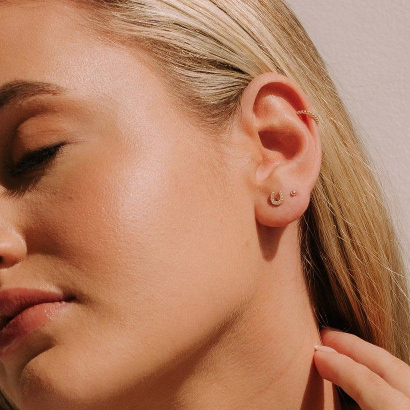 Micro Horseshoe Studs in Gold